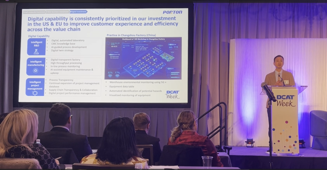 A man giving a presentation at a conference.